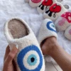 MAKE YOU SNUGGLE EVIL EYE SLIPPERS